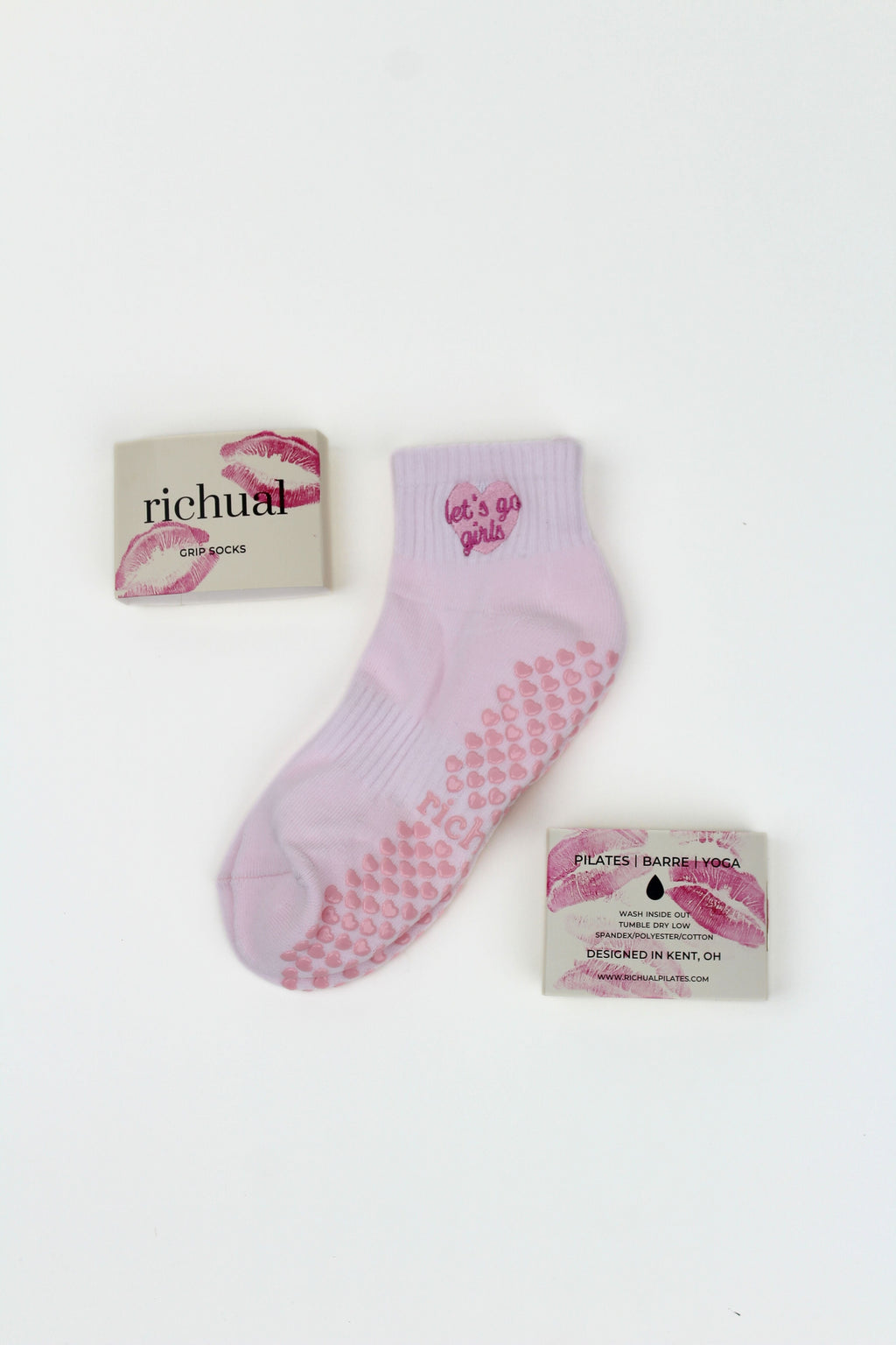 PREORDER: Let's Go Girls Grip Socks in pink with heart-shaped grips and matching packaging on a white background