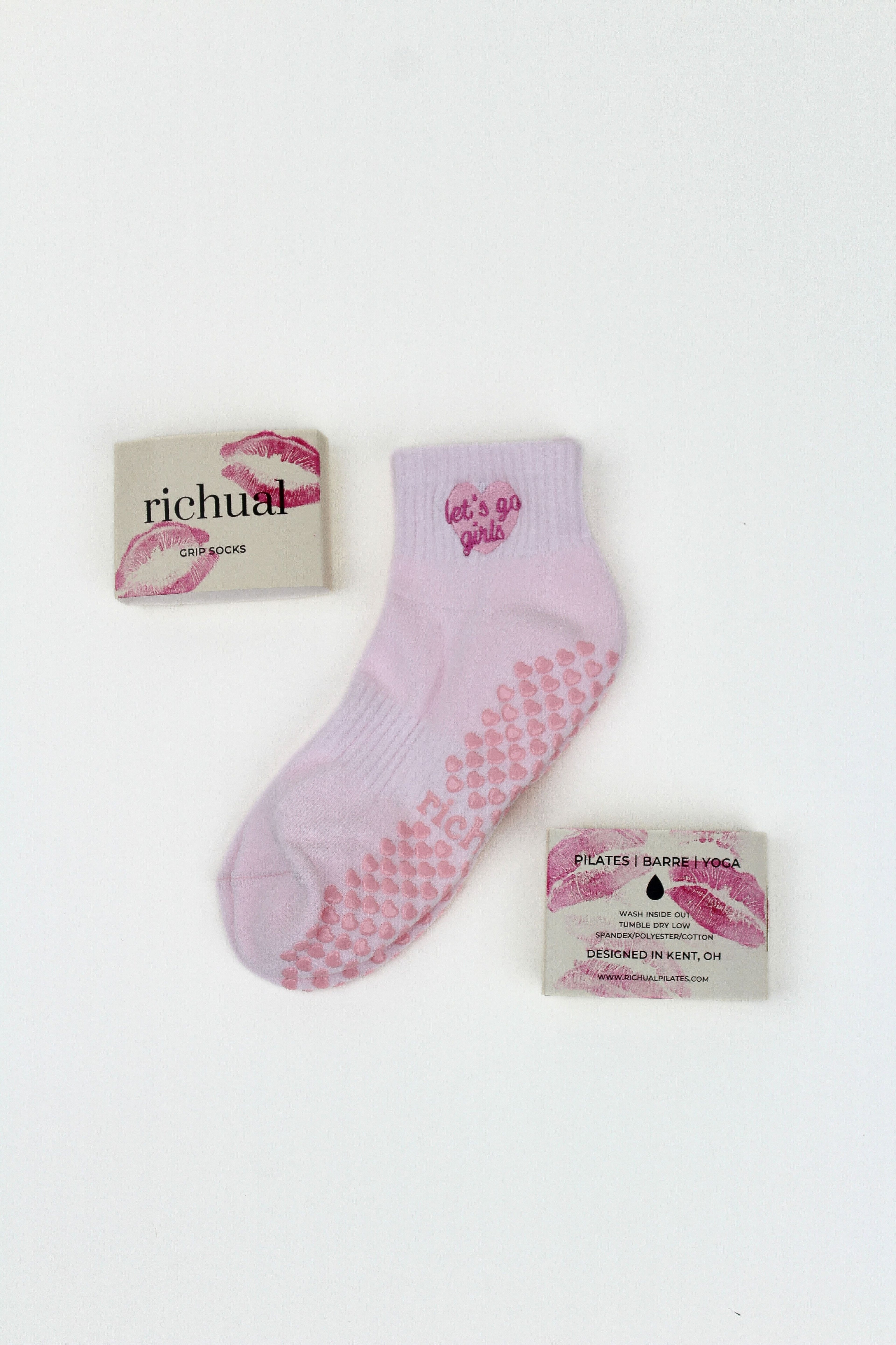 PREORDER: Let's Go Girls Grip Socks in pink with heart-shaped grips and matching packaging on a white background